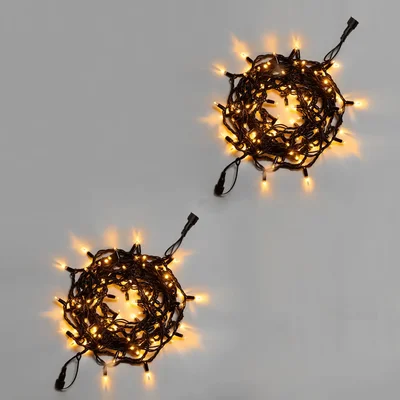 Нить 10м, мерцающая тёплым белым, 220В, IP65, чёрный резиновый провод 3.3мм, ТЕПЛЫЙ БЕЛЫЙ