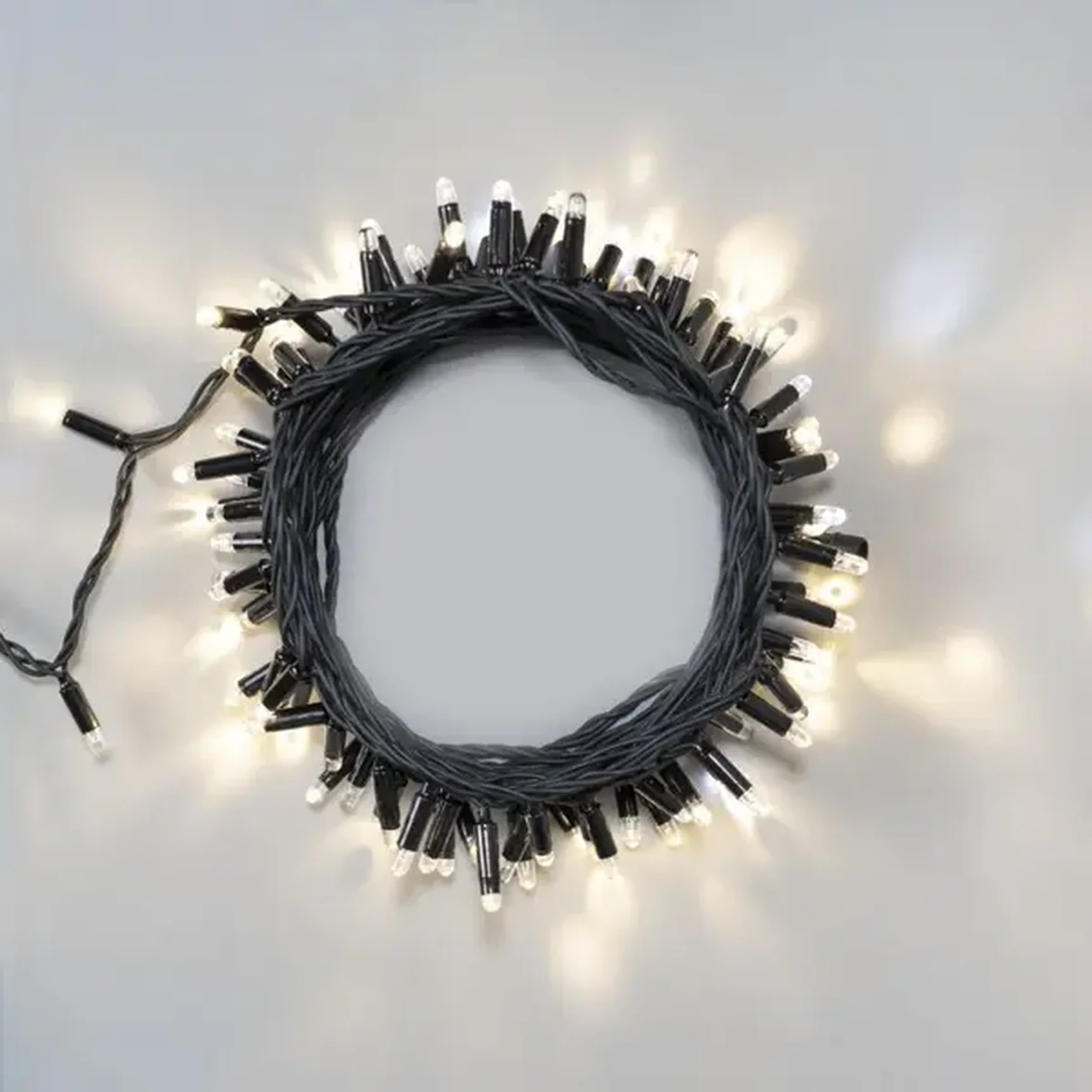 Гирлянда Нить 10м Тепло-Белая с Мерцанием Белого Диода 24В, 100 LED, Провод Черный Каучук 2,3мм, IP65