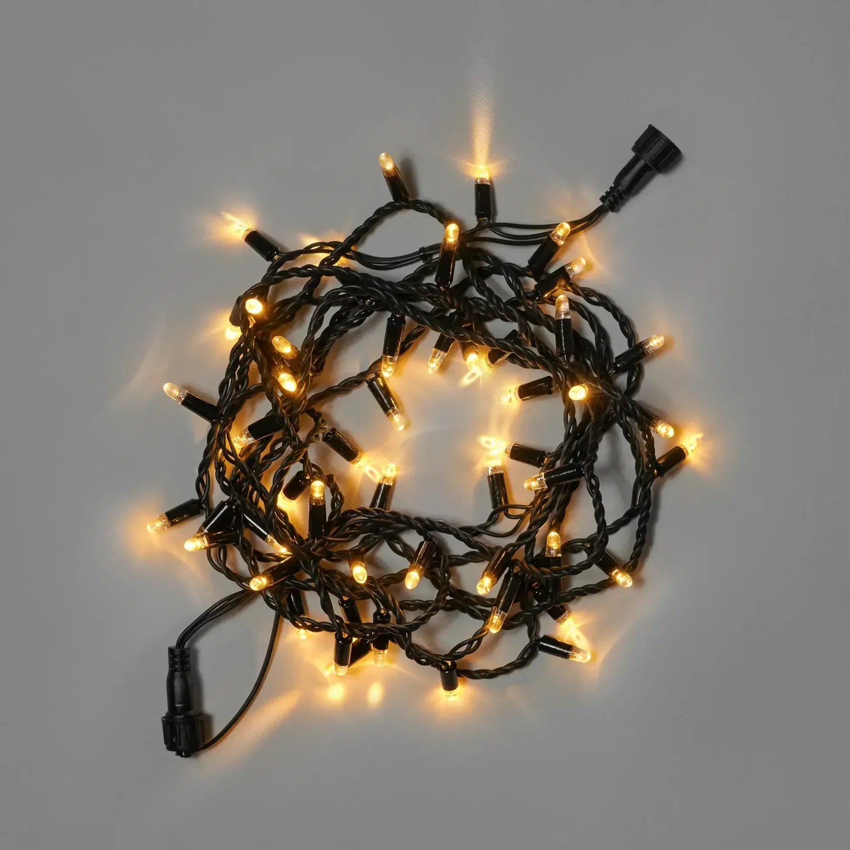 Светодиодная гирлянда INOXHUB Нить 10м, 100 LED, соединяемая, 24В, IP65, чёрный резиновый провод 2.3мм, ТЕПЛАЯ БЕЛАЯ