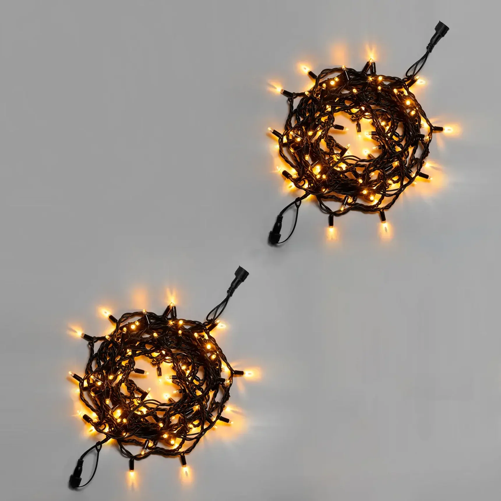 Нить 10м, 100 LED, соединяемая, 220В, IP65, чёрный резиновый провод 3.3мм, ТЕПЛЫЙ БЕЛЫЙ